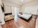 Bedroom boasting hardwood floors, a window with bright light, and a closet with a barn style door at 1515 E 31St Ave, Tampa, FL 33610