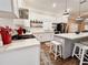 Stylish kitchen featuring white cabinets, stainless steel appliances, and a view into the dining area at 1515 E 31St Ave, Tampa, FL 33610