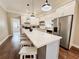 Bright, modern kitchen with white cabinets, stainless steel appliances, and a large island at 1515 E 31St Ave, Tampa, FL 33610