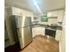 Modern kitchen with stainless steel appliances and ample cabinet space, perfect for cooking at 1515 E 31St Ave, Tampa, FL 33610