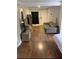 Comfortable living room with a TV, a stylish couch, and a partial view of the bedroom at 1515 E 31St Ave, Tampa, FL 33610