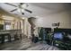 Open concept living space features wood-look flooring, a breakfast bar, and a staircase at 15733 Fishhawk Falls Dr, Lithia, FL 33547
