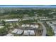 Overhead view of homes with a red pinpoint indicator, nestled in a green, tree-filled community at 1805 Vera Pl # 2, Sarasota, FL 34235