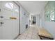 Inviting hallway features tiled floors, a decorative front door, and soothing wall color at 1805 Vera Pl # 2, Sarasota, FL 34235