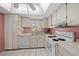 Functional kitchen with white appliances and ample cabinet space at 1805 Vera Pl # 2, Sarasota, FL 34235