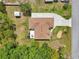 Top-down aerial view of the house highlighting yard, patio, and proximity to adjacent homes at 2016 Alameda Dr, Spring Hill, FL 34609