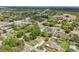 An elevated view of the house and its well-established neighborhood surrounded by lush greenery at 2016 Alameda Dr, Spring Hill, FL 34609