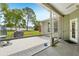 This covered patio has access to the outdoor kitchen, grill, patio set and spacious backyard at 2016 Alameda Dr, Spring Hill, FL 34609