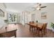 Dining area with natural light, seamlessly connecting to the front entrance and other living spaces at 2016 Alameda Dr, Spring Hill, FL 34609