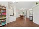 Bright dining area with wood floors and sliding glass doors to the backyard at 2016 Alameda Dr, Spring Hill, FL 34609