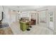 Kitchen featuring white cabinets, granite countertops, and an open view to the dining room at 2016 Alameda Dr, Spring Hill, FL 34609