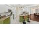 Spacious kitchen with white cabinets, granite countertops, and breakfast bar at 2016 Alameda Dr, Spring Hill, FL 34609