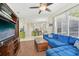Open-concept layout featuring a living area with a sectional sofa and access to a modern kitchen at 2016 Alameda Dr, Spring Hill, FL 34609