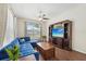 Comfortable living area featuring a stylish sectional sofa, a media center, and views of the kitchen at 2016 Alameda Dr, Spring Hill, FL 34609