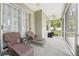 Relax on the covered patio with ceiling fan and relax on the comfortable wicker furniture at 2016 Alameda Dr, Spring Hill, FL 34609
