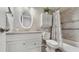 Bathroom features a vanity with granite counters, a white toilet, and a shower-tub with a shower curtain at 2042 Australia W Way # 12, Clearwater, FL 33763