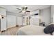 Bedroom featuring built-in storage cabinets, neutral tones, and hardwood floors for a cozy and functional space at 2042 Australia W Way # 12, Clearwater, FL 33763