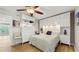 Comfortable bedroom featuring ample storage space, neutral decor, and hardwood floors for a relaxing ambiance at 2042 Australia W Way # 12, Clearwater, FL 33763