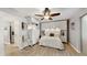 Bedroom featuring modern cabinetry, sleek ceilings fan and hardwood floors for a relaxing space at 2042 Australia W Way # 12, Clearwater, FL 33763