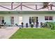 Charming condo featuring manicured landscaping and decorative potted plants at 2042 Australia W Way # 12, Clearwater, FL 33763