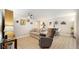 Cozy living room featuring neutral tones, ceiling fan, and a dining area at 2042 Australia W Way # 12, Clearwater, FL 33763