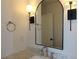 Updated bathroom with a marble countertop and modern lighting fixtures at 2105 Curry Rd, Lutz, FL 33549
