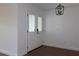 Bright entryway showcasing glass paneled double doors and modern black light fixture at 2105 Curry Rd, Lutz, FL 33549