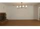 Spacious living room with hardwood floors and brick fireplace at 2105 Curry Rd, Lutz, FL 33549