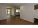 Spacious living room features hardwood floors, leading to glass paneled entryway doors at 2105 Curry Rd, Lutz, FL 33549