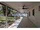 Expansive covered patio ideal for outdoor relaxation and entertaining, with a view of the lush backyard at 2105 Curry Rd, Lutz, FL 33549