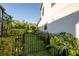 Backyard view showing a fenced in yard and lush landscaping around the property at 21867 Amelia Rose Way, Land O Lakes, FL 34637