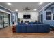 Open living room with wood-look tile flooring, a fireplace, and comfortable seating at 21867 Amelia Rose Way, Land O Lakes, FL 34637
