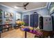 Home office showcases built-in shelving, wood-look floors, and soft blue walls at 21867 Amelia Rose Way, Land O Lakes, FL 34637