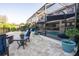 Large stone patio with outdoor seating at 21867 Amelia Rose Way, Land O Lakes, FL 34637