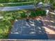 Aerial view of a home with a private basketball court, perfect for outdoor recreation and sports at 307 Oleander Rd, Belleair, FL 33756