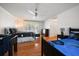 Bright bedroom featuring hardwood floors, ceiling fan, and bright windows at 307 Oleander Rd, Belleair, FL 33756