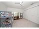 Bright bedroom with bunk beds, ceiling fan, and double closet at 307 Oleander Rd, Belleair, FL 33756