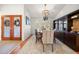 Dining room with a wooden table, chandelier, and dark wood china cabinet at 307 Oleander Rd, Belleair, FL 33756