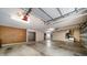 Spacious garage with ample storage space, work bench, and concrete floors at 307 Oleander Rd, Belleair, FL 33756