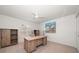 Home office features a built-in desk, shelving and ample natural light at 307 Oleander Rd, Belleair, FL 33756