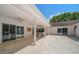 Spacious covered patio with tile floors, ceiling fans, and outdoor dining area at 307 Oleander Rd, Belleair, FL 33756