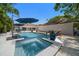 Backyard pool and spa with tropical landscaping, offering a relaxing outdoor oasis at 307 Oleander Rd, Belleair, FL 33756