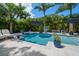 Inviting backyard pool and spa area with sun loungers and lush tropical landscaping at 307 Oleander Rd, Belleair, FL 33756