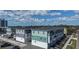 A higher-level aerial view of a set of modern townhomes, showcasing their architecture and street access at 3113 4Th N Ter, St Petersburg, FL 33713
