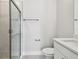 Modern bathroom featuring a glass shower, neutral tiling, and white fixtures for a clean, contemporary look at 3113 4Th N Ter, St Petersburg, FL 33713