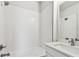 Bathroom featuring a tiled shower-tub combination and a sleek vanity with modern fixtures at 3113 4Th N Ter, St Petersburg, FL 33713