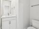 Bathroom featuring a white vanity, toilet, tiled floor, and a brushed nickel towel rack at 3113 4Th N Ter, St Petersburg, FL 33713