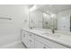 Bathroom featuring a double sink vanity with modern fixtures and a large mirror at 3113 4Th N Ter, St Petersburg, FL 33713