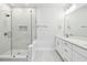 Modern bathroom featuring a glass enclosed shower and a double sink vanity with contemporary fixtures at 3113 4Th N Ter, St Petersburg, FL 33713