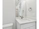 Bright bathroom with a modern vanity, quartz countertop, and a large mirror reflecting a shower at 3113 4Th N Ter, St Petersburg, FL 33713